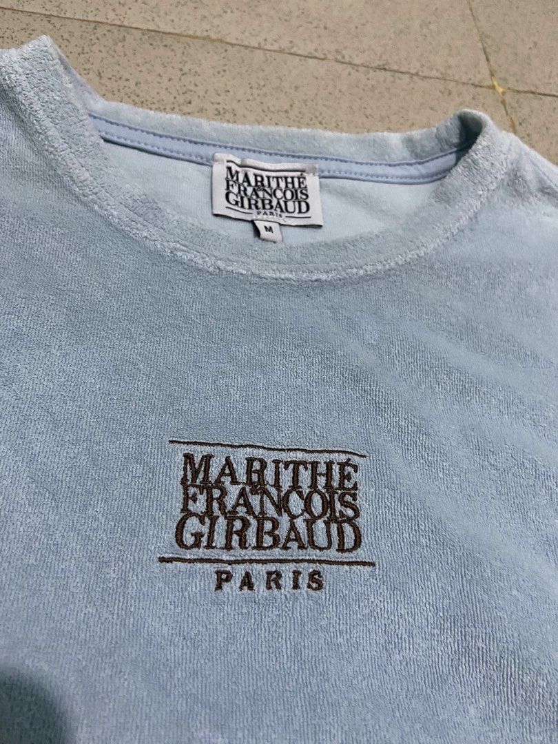 Marithe Francois Girbaud Light Blue Terry Cloth T-Shirt Size M (Category: Tshirts & Polo Shirts ) located in Bulacan. Submitted by rrthrifts (Listing ID 1462353805, Image 2). Description: - Brand: Marithe Francois Girbaud - Color: Light Blue - Material: Terry Cloth (Cotton & Polyester Blend) - Features: Embroidered chest logo, neck tag logo - Size: Medium (M) - Style: Casual wear.