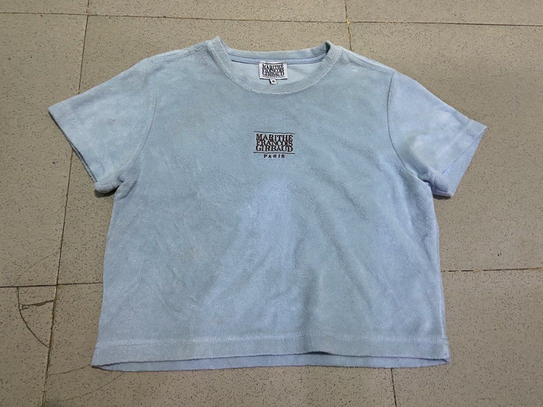 Marithe Francois Girbaud Light Blue Terry Cloth T-Shirt Size M (Category: Tshirts & Polo Shirts ) located in Bulacan. Submitted by rrthrifts (Listing ID 1462353805, Image 1). Description: - Brand: Marithe Francois Girbaud - Color: Light Blue - Material: Terry Cloth (Cotton & Polyester Blend) - Features: Embroidered chest logo, neck tag logo - Size: Medium (M) - Style: Casual wear.