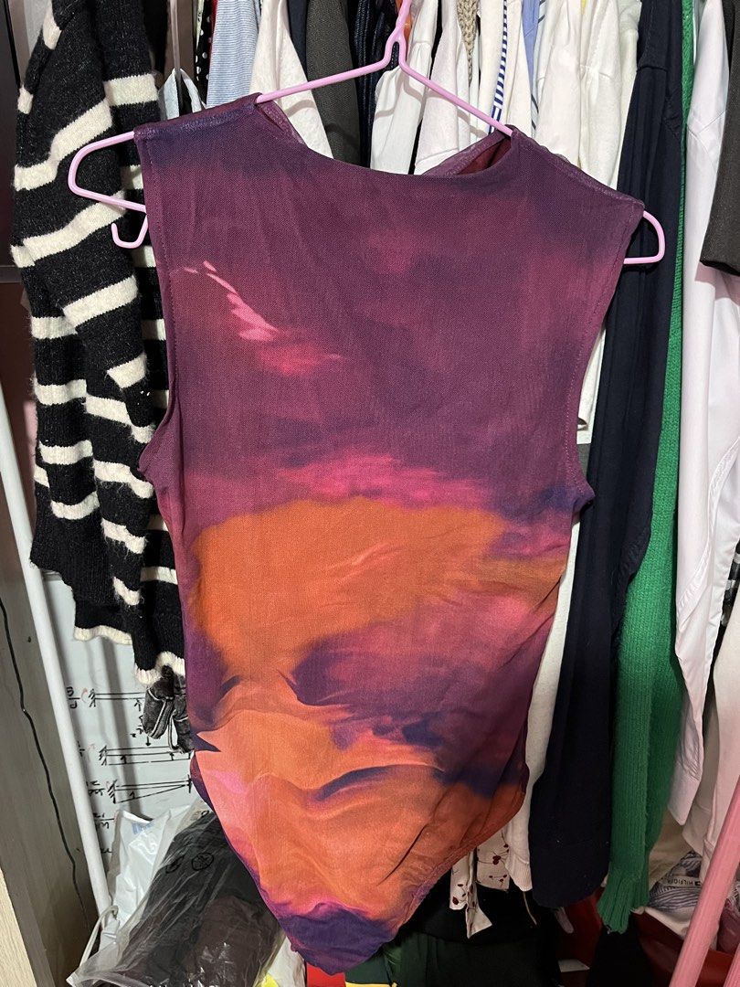 Mesh Sunset Print Sleeveless Bodysuit (Category: Sleeveless) located in Valenzuela. Submitted by skiesrc (Listing ID 1462312209, Image 3). Description: - Vibrant sunset print mesh bodysuit - Sleeveless design - Sheer and lightweight fabric - Flattering cut - Versatile for layering or wearing solo - Unique, eye-catching design.