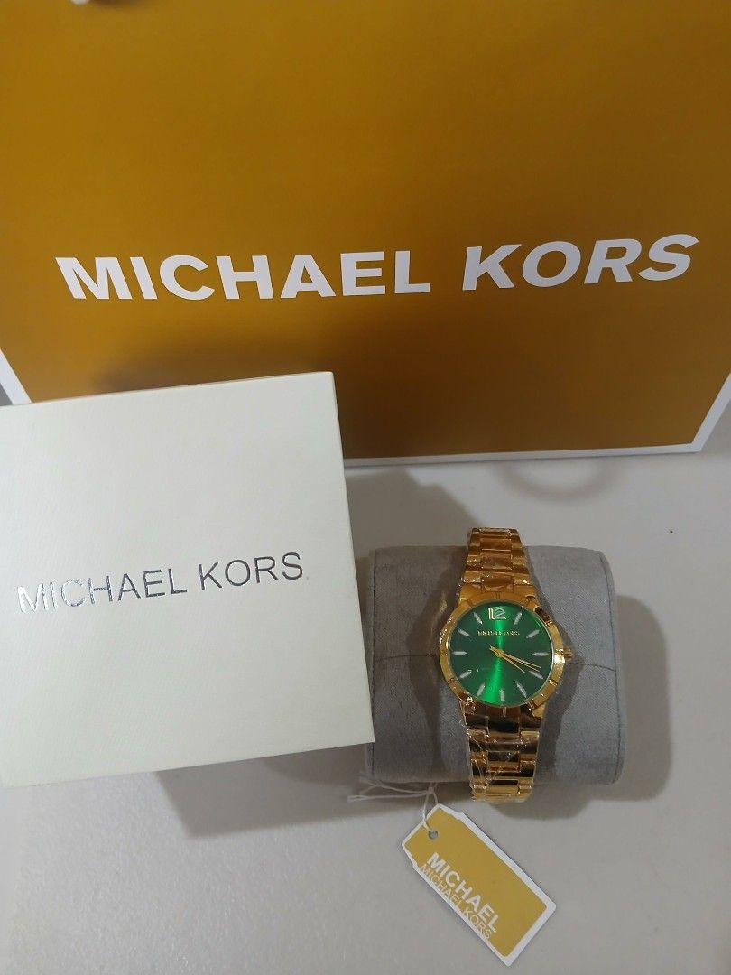 Michael Kors Gold Watch Green Dial (Category: Women's Watches) located in Manila. Submitted by alegriacyr19 (Listing ID 1462322803, Image 1). Description: - Top Grade Watch - Brand new Michael Kors watch - Elegant gold design - Striking green dial - Gold hands and numbers - Includes original box and tag - Never worn - Ideal gift for any occasion.