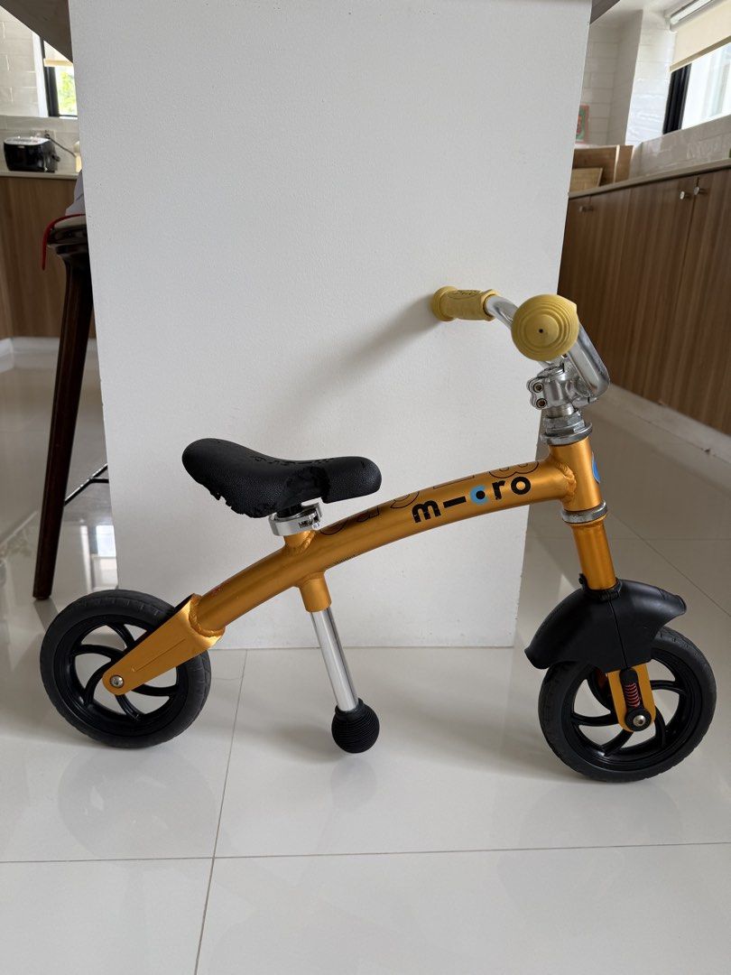 Micro Balance Bike - Orange/Gold (Category: Bicycles) located in Bacoor. Submitted by cts217 (Listing ID 1462311908, Image 1). Description: - Gold Micro balance bike - Perfect for teaching kids to balance - Overall good condition but saddle is crumbling due to prolonged storage.
