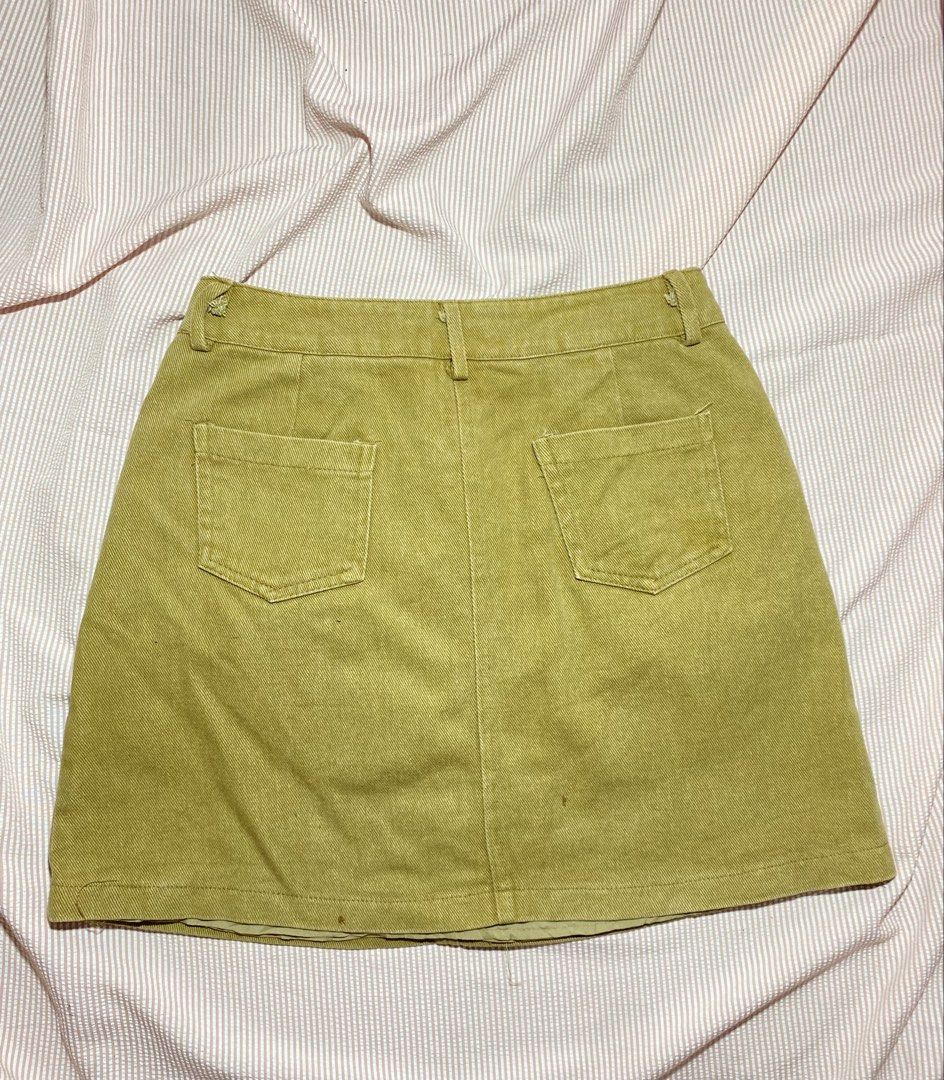 Mika Studio Denim Skirt - Khaki (Category: Skirts) located in Paranaque City. Submitted by golden_jinkay (Listing ID 1462424244, Image 2). Description: -Waist 26-28 -Lenght 16 - Khaki denim skirt from Mika Studio - Classic A-line cut - Front zipper and button closure - Two front pockets and two back pockets - Label: W:26-28, L:16 - Perfect staple piece for any wardrobe.