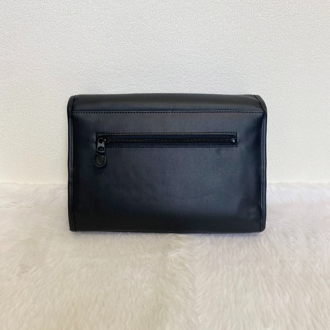 Mila Schon Black Leather Clutch Bag (Category: Belt bags, Clutches and Pouches) located in Cebu City. Submitted by posh_avenue888 (Listing ID 1462355976, Image 3). Description: In excellent like new condition. From Japan. Crafted in genuine leather. 100% authentic!!! 10" x 7" x 3"..