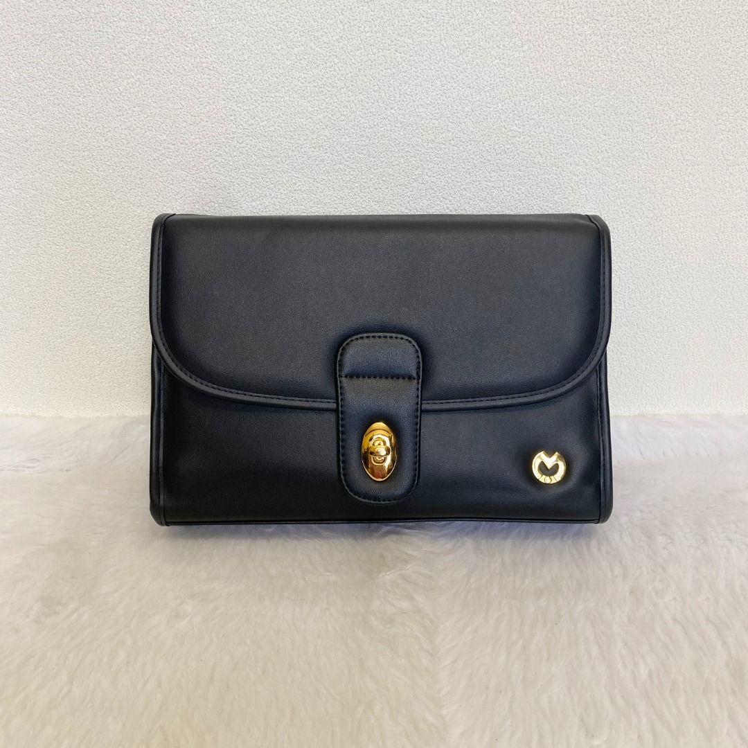 Mila Schon Black Leather Clutch Bag (Category: Belt bags, Clutches and Pouches) located in Cebu City. Submitted by posh_avenue888 (Listing ID 1462355976, Image 1). Description: In excellent like new condition. From Japan. Crafted in genuine leather. 100% authentic!!! 10" x 7" x 3"..