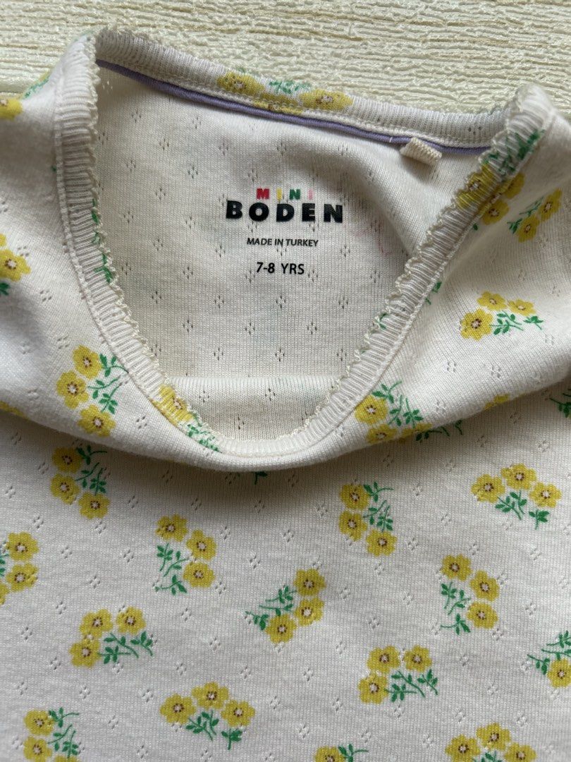 Mini Boden t-shirt (Category: Babies & Kids Fashion) located in Cebu City. Submitted by yjainani (Listing ID 1462344792, Image 3). Description: cream short-sleeve girls' t-shirt from Mini Boden featuring a delicate yellow floral pattern and a textured pointelle knit.
