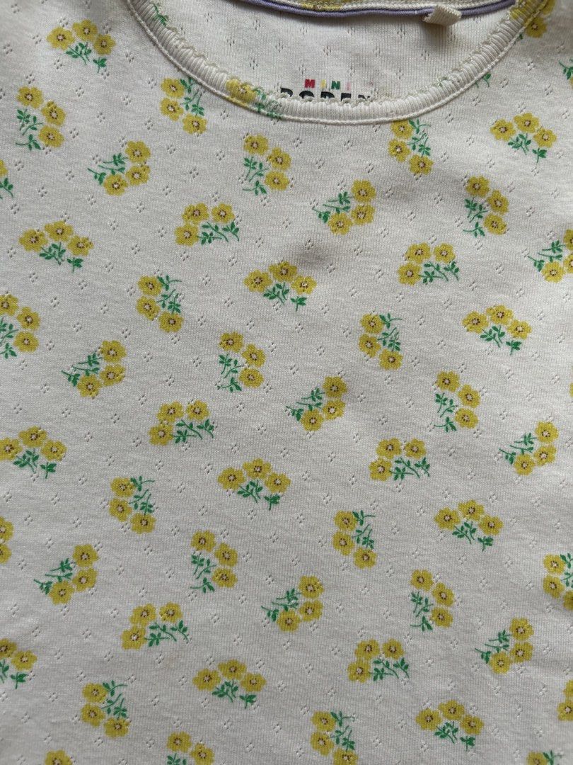 Mini Boden t-shirt (Category: Babies & Kids Fashion) located in Cebu City. Submitted by yjainani (Listing ID 1462344792, Image 2). Description: cream short-sleeve girls' t-shirt from Mini Boden featuring a delicate yellow floral pattern and a textured pointelle knit.