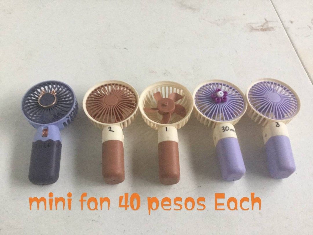 Mini Portable Handheld Fans - 40 Pesos Each (Category: Fans) located in Caloocan City. Submitted by samyx23 (Listing ID 1462354436, Image 1). Description: - Cute and portable mini fans - Stay cool on the go! - Available in different colors - Price: 40 pesos each - Get yours today!.