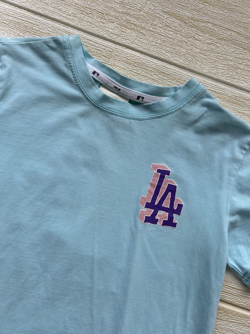 MLB Los Angeles Dodgers kids tshirt (Category: Babies & Kids Fashion) located in Cebu City. Submitted by yjainani (Listing ID 1462351279, Image 2). Description: light blue MLB Los Angeles Dodgers kids' short-sleeve t-shirt featuring a small "LA" logo on the chest size 110 (2-3T).