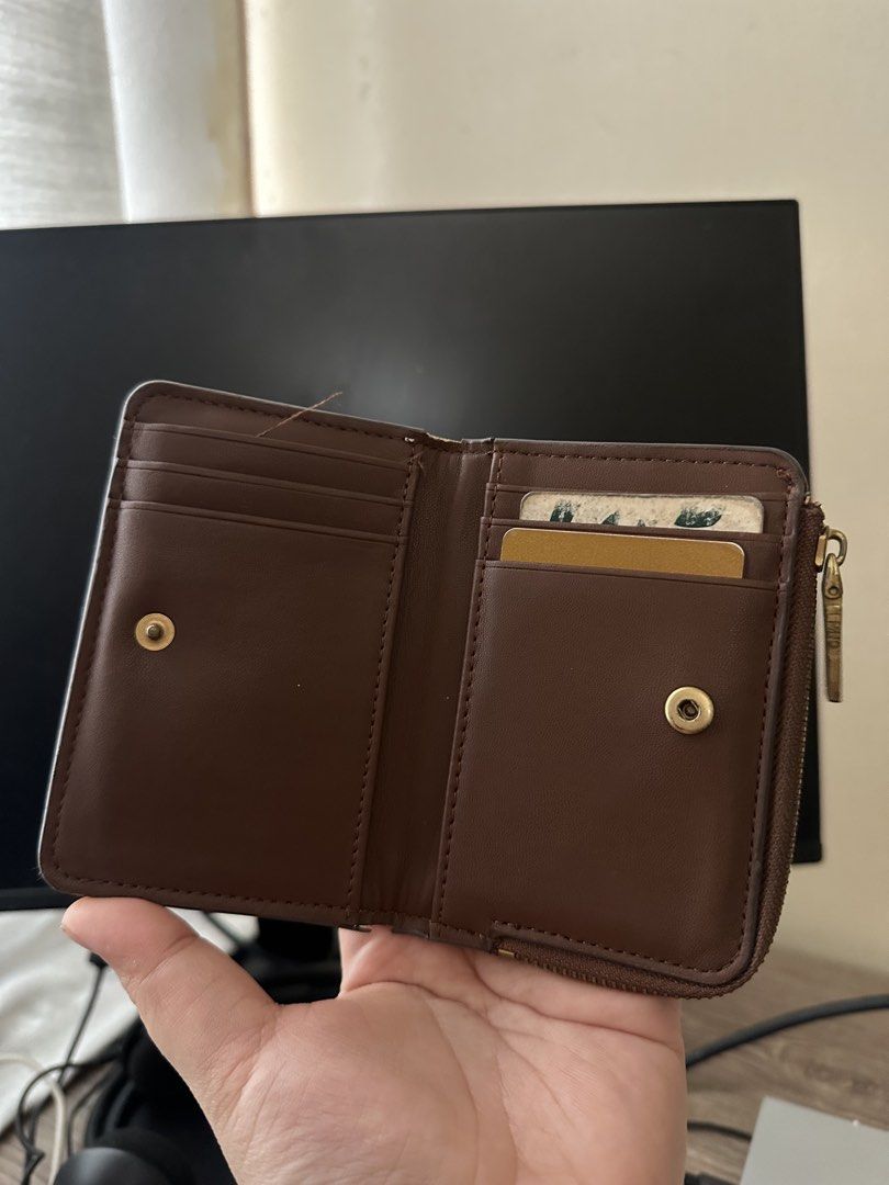 MNG Monogram Zip Around Wallet Brown (Category: Wallets & Card holders) located in Dasmarinas. Submitted by paulaaa_ (Listing ID 1462290795, Image 2). Description: - Brown MNG wallet - Features classic monogram pattern - Secure zip-around closure - Interior includes card slots and a coin pocket - Small and compact size, ideal for everyday use.