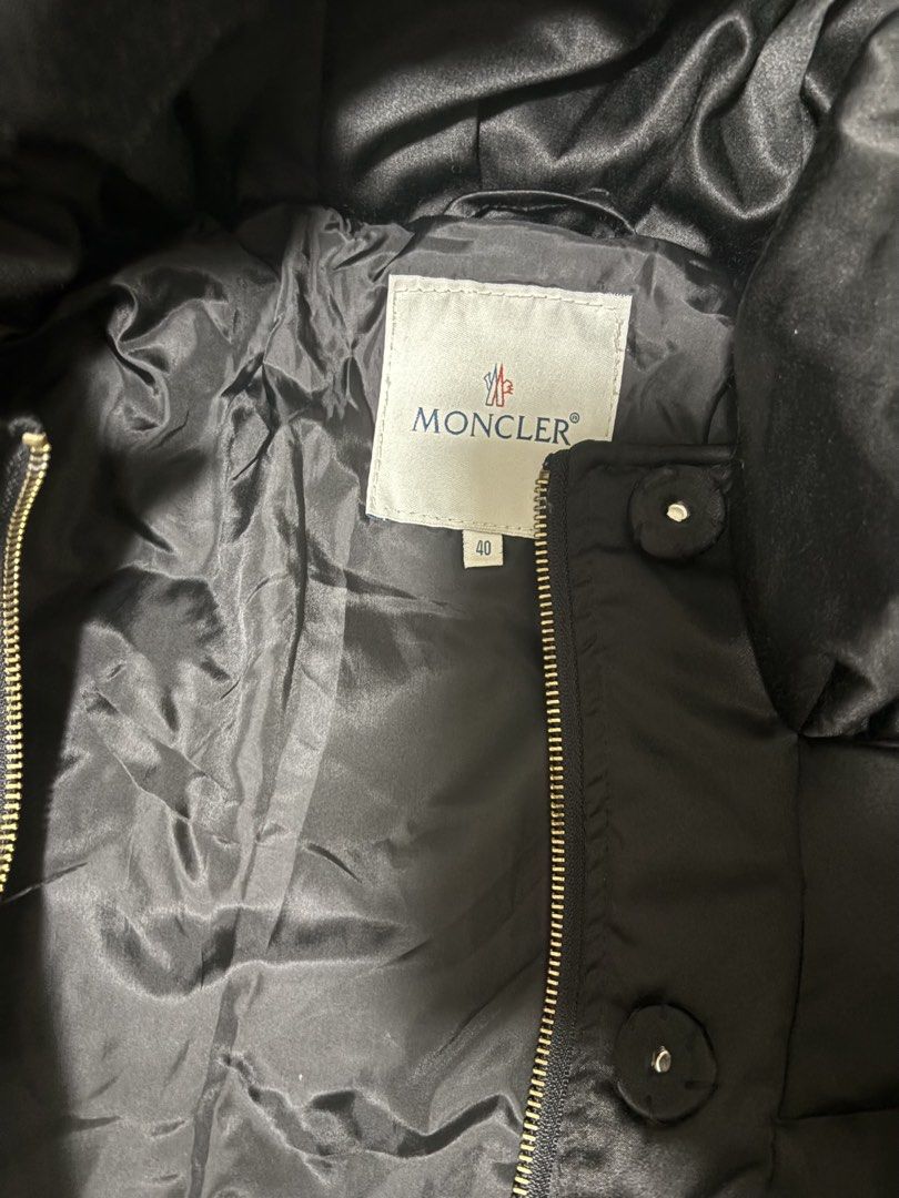 Moncler Black Puffer Jacket with Fur Trim (Category: Coats, Jackets and Outerwear) located in Quezon City. Submitted by bluefrenchorn (Listing ID 1462327882, Image 3). Description: - Moncler puffer jacket - Color: black - Cozy fur trim down the front - Designed for warmth and style in cold weather Measurements: 18x33 inches.