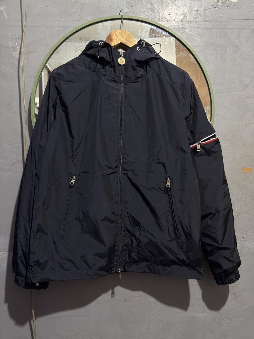 Moncler Hoodie -Light Weight Rain Jacket (Category: Tshirts & Polo Shirts ) located in Manila. Submitted by tindero-ng-damit (Listing ID 1462401174, Image 1). Description: Name: Moncler Rain Jacket Hoodie Light weight - Water resistant Color: Navy No issue - Flawless Complete tags 🏷️ Measurement: Large 23 width - 28 Length a bit nego for sure taker.