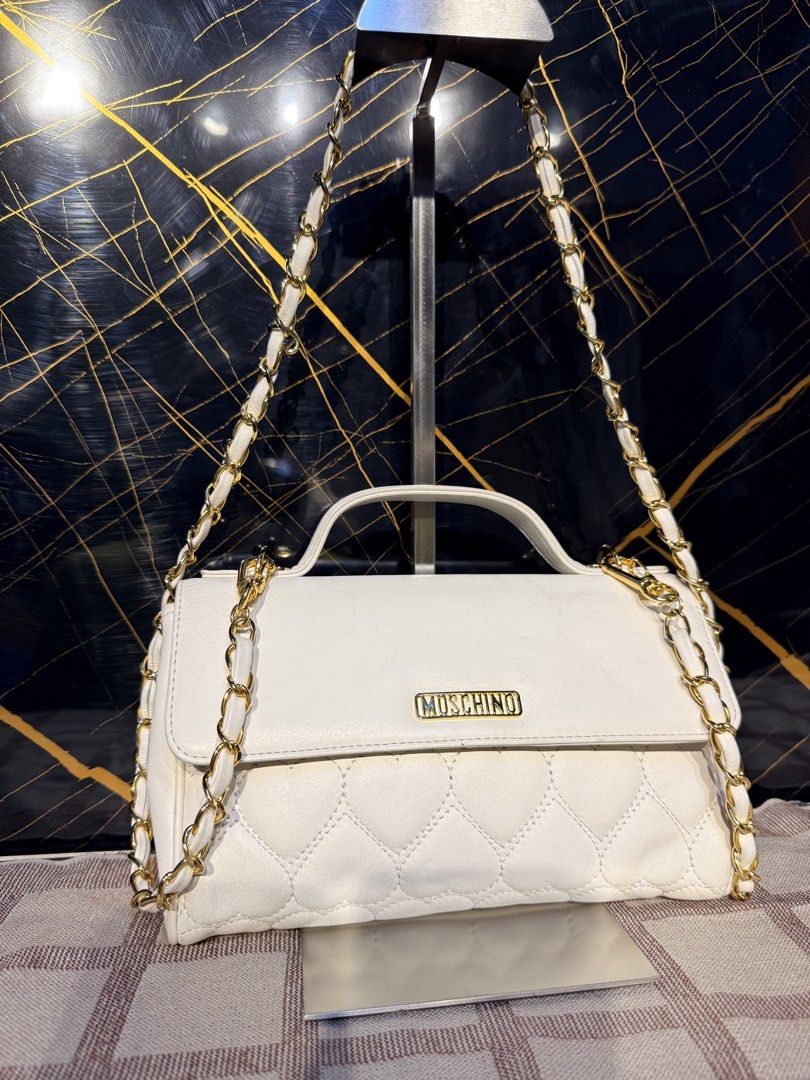 Moschino Patent Leather Shoulder bag (Category: Luxury Bags & Wallets) located in Santiago. Submitted by twicebutnice03 (Listing ID 1462305176, Image 2). Description: Authentic Moschino bag no issue As new condition Cam fit Phone and wallet.