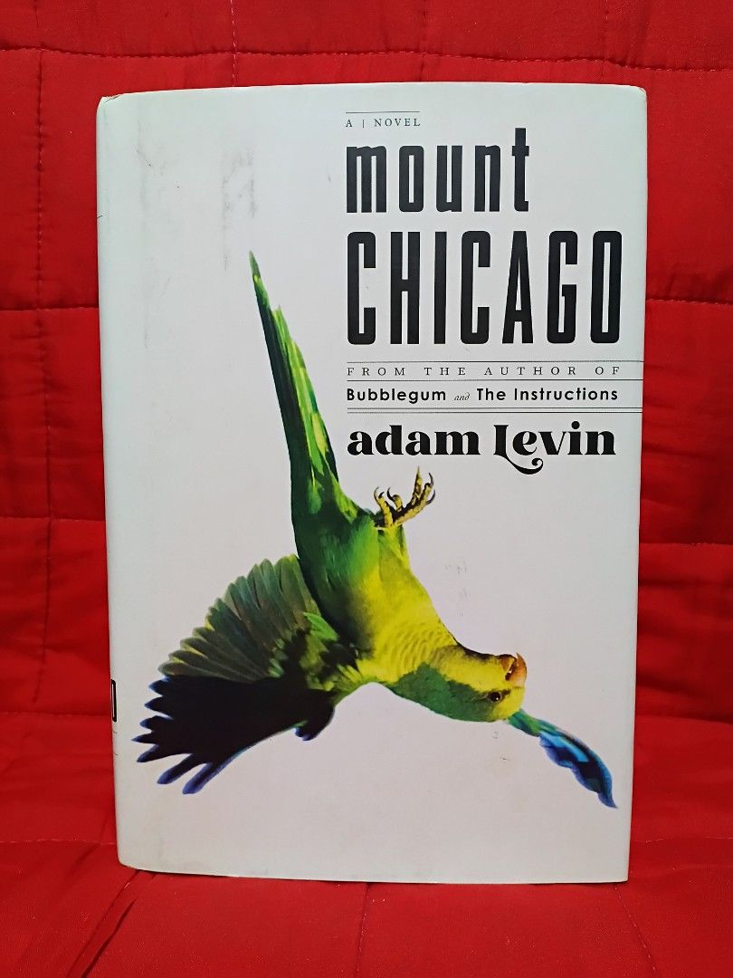 Mount Chicago (Category: Storybooks) located in Manila. Submitted by krishna_ayanami (Listing ID 1462435173, Image 1). Description: Hey mga ka-bookworm! " This is a novel that's sure to keep you hooked! The cover features a vibrant green parrot in flight, adding a unique touch to this pre-loved book. Perfect for those who love a good read and appreciate a bit of artistic flair on their book covers. Happy reading!.