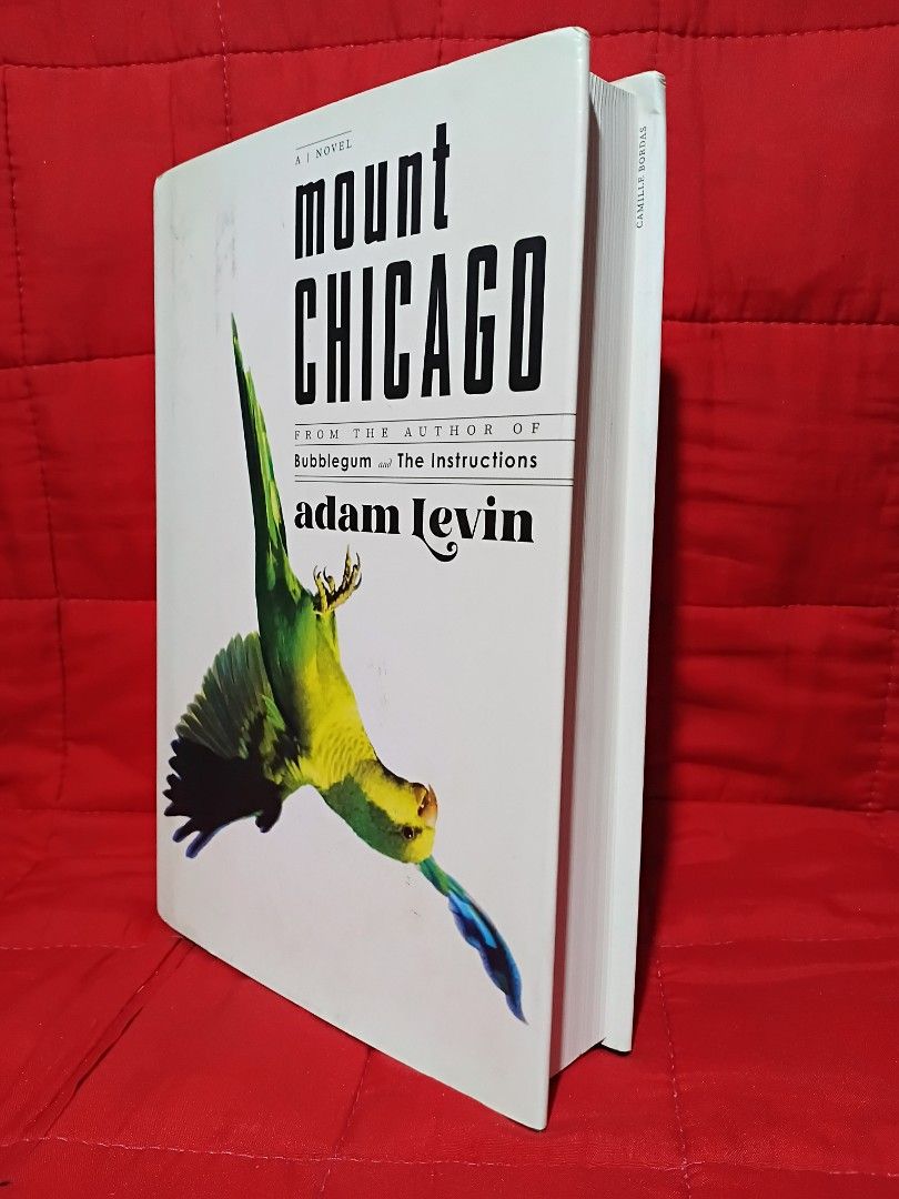 Mount Chicago (Category: Storybooks) located in Manila. Submitted by krishna_ayanami (Listing ID 1462435173, Image 2). Description: Hey mga ka-bookworm! " This is a novel that's sure to keep you hooked! The cover features a vibrant green parrot in flight, adding a unique touch to this pre-loved book. Perfect for those who love a good read and appreciate a bit of artistic flair on their book covers. Happy reading!.