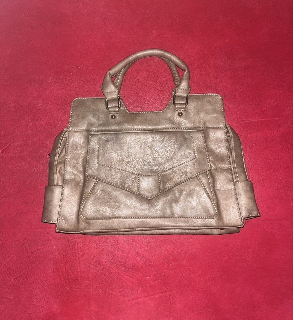 Multi-pocket Proenza Schouler Satchel bag (Category: Shoulder Bags) located in Davao. Submitted by janna_soleil (Listing ID 1462291759, Image 1). Description: taupe leather Proenza Schouler PS13 satchel featuring a distinct front pocket with a geometric fold-over flap.