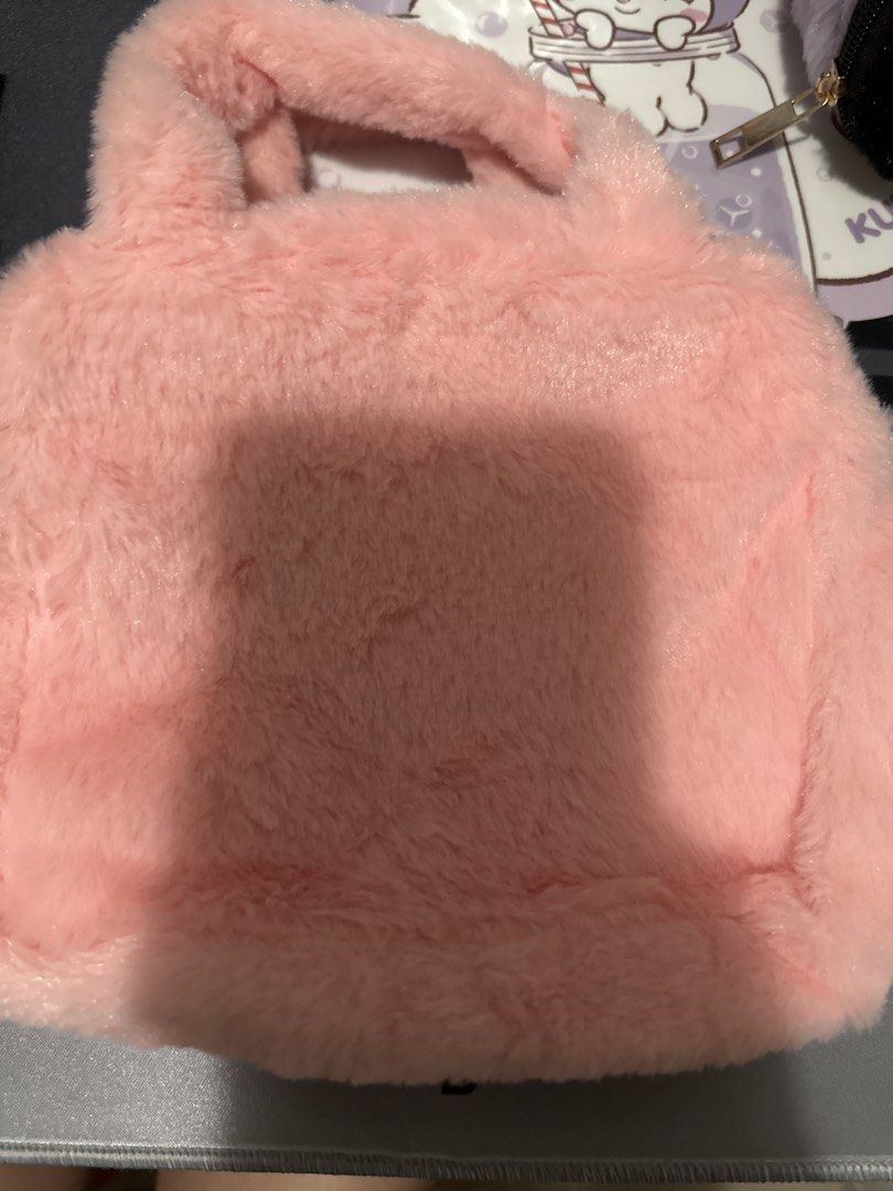 My Melody Plush Handbag with Gingham Bow (Category: Tote Bags) located in Manila. Submitted by lunalux09 (Listing ID 1462359342, Image 2). Description: - Adorable pink plush handbag featuring My Melody's face. - Cute gingham bow detail. - Secure zipper closure for your belongings. - Made with soft and fluffy material. - Ideal for carrying small essentials..