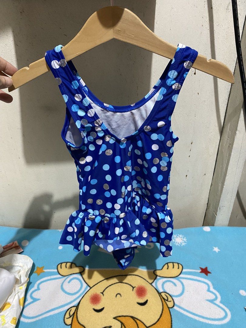 Nassau Blue Polka Dot Ruffle Swimsuit (Category: Babies & Kids Fashion) located in Manila. Submitted by resi.diaz (Listing ID 1462321532, Image 2). Description: - Adorable blue swimsuit with charming polka dot pattern. - Features a cute ruffle hem for extra flair. - Ideal for swimming lessons, beach trips, or any water play. - Comfortable straps and secure fit for active kids. - Brand: Nassau - Size: 45- chest circumference 50- hip circumference 