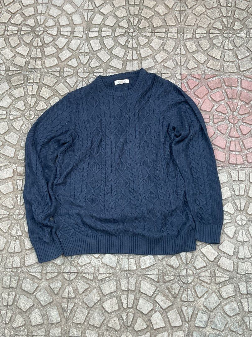 Navy Blue Cable Knit Crewneck Sweater (Category: Coats, Jackets and Outerwear) located in Mabalacat. Submitted by epicforest_78284 (Listing ID 1462398824, Image 1). Description: - Classic navy blue sweater - Cable knit pattern - Crewneck style - Ribbed cuffs and hem - Comfortable and versatile for layering - Ideal for cooler weather - Pairs well with jeans or trousers.