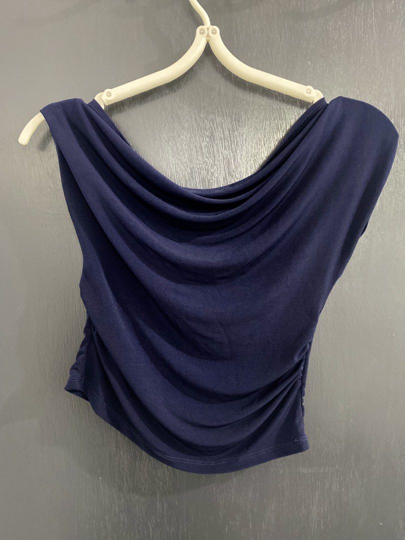 Navy Blue Drape Neck Ruched Side Crop Top (Category: Sleeveless) located in Manila. Submitted by cieedeclutters (Listing ID 1462340551, Image 2). Description: - Navy blue crop top - Features a stylish cowl neckline - Side ruching for a flattering fit - Sleeveless design - Made from a stretchy material - Perfect for dressing up or down.