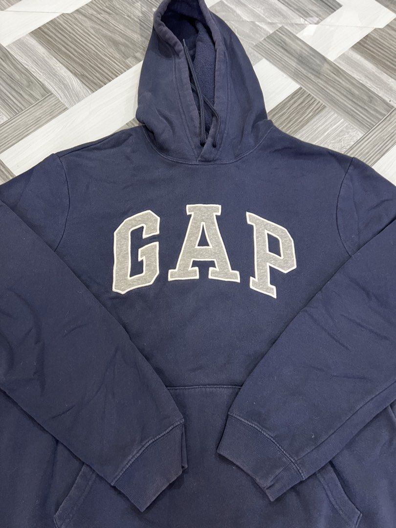 Navy Blue GAP Hoodie Size M (Category: Hoodies) located in Baguio. Submitted by zyddd014 (Listing ID 1462352975, Image 3). Description: - Classic navy blue GAP hoodie - Iconic grey GAP logo across the chest - Front pocket - Drawstring hood - Size: Medium - Made in Cambodia - 350 Baguio loc.