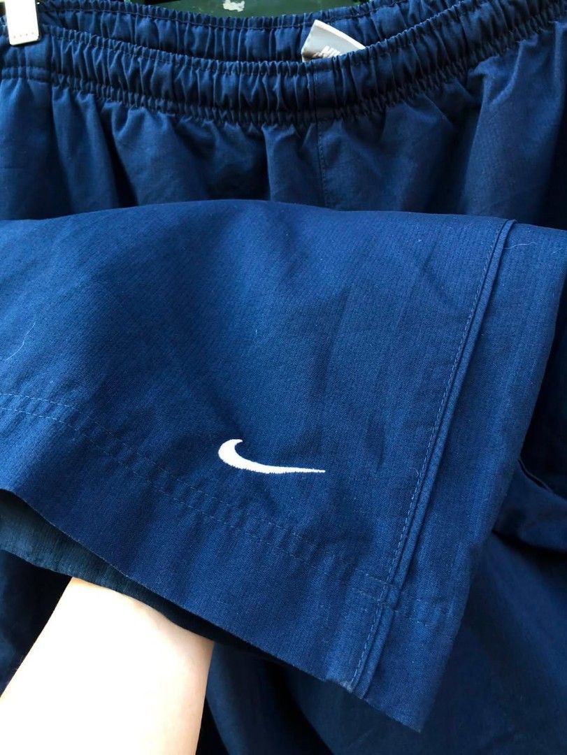 Navy Blue Nike Track Pants 34/38(41) (Category: Joggers) located in Manila. Submitted by kuyanyo (Listing ID 1462352266, Image 3). Description: - Classic navy blue Nike track pants - Elastic waistband with drawstring for adjustable fit - Convenient side pockets - Subtle Nike swoosh logo on the left leg - Ideal for casual outings or athletic activities - Offers a comfortable and relaxed fit.