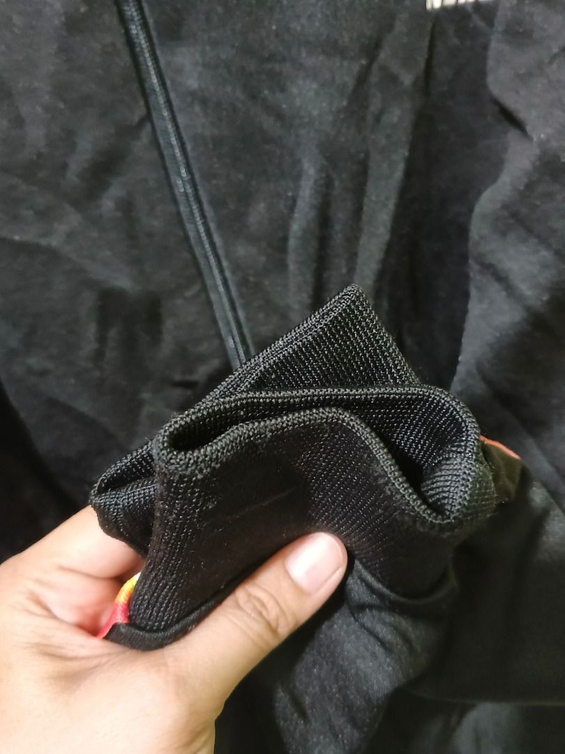 NERDY Black Track Jacket with Striped Sleeves (Category: Coats, Jackets and Outerwear) located in Urdaneta. Submitted by fastbird.12354e (Listing ID 1462327290, Image 3). Description: - Dimension: 22 x 26 - Brand: NERDY - Color: Black - Design: Brand name on chest and sleeves, colorful stripe detail - Features: Full zip front, stand-up collar, ribbed cuffs and hem - Style: Ideal for casual wear or sports.