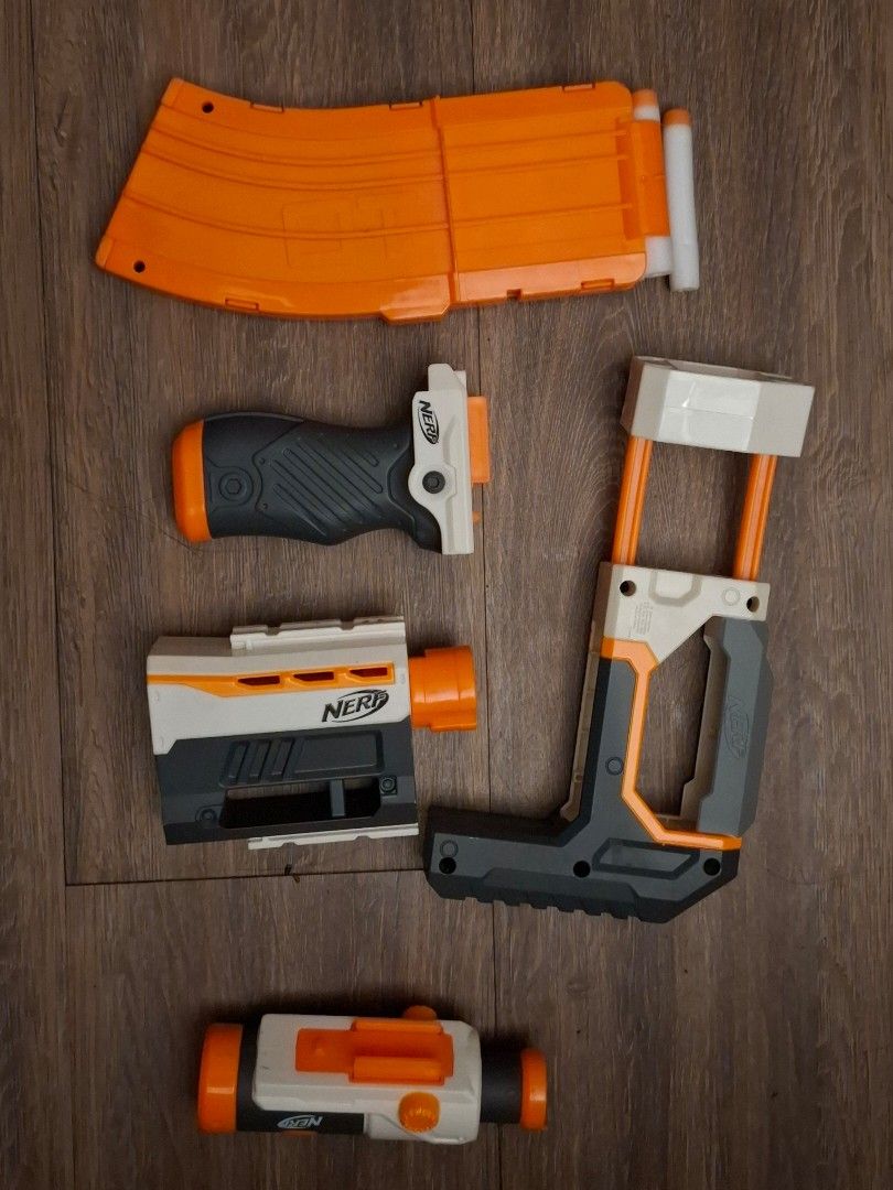Nerf Modulus ECS-10 Blaster Toy Gun with Accessories (Category: Action & Battle Toys) located in Pasay City. Submitted by makkimonti (Listing ID 1462428245, Image 2). Description: has a bent storage stock (see slide 3) still attaches to maintain blaster - 8 darts has not been tested/used for the past 8 years needs batteries (4 AA) RFS: Decluttering - Nerf Modulus toy gun blaster - Includes stock attachment - Includes foregrip attachment - Include
