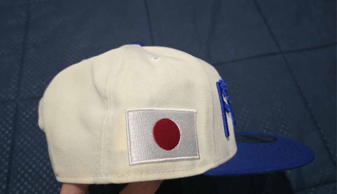 New Era 9FIFTY Snapback Dodgers Japanese Cap (Category: Caps & Hats) located in Santa Rosa. Submitted by rowhell09 (Listing ID 1462388844, Image 3). Description: Dodgers Kanji Two Tone Brand new 2300 MOD. LBC MOP. BDO, GCASH LOC. NUEVA ECIJA - Brand: New Era - Style: 9FIFTY Snapback - Color: Cream and Royal Blue - Features: Japanese text embroidery on front, Japan flag patch on side - Ideal for: Dodgers fans, streetwear enthusiasts.