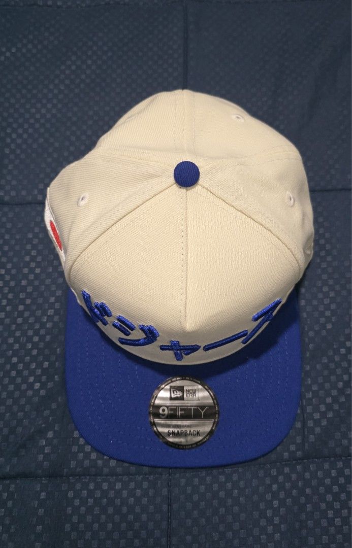 New Era 9FIFTY Snapback Dodgers Japanese Cap (Category: Caps & Hats) located in Santa Rosa. Submitted by rowhell09 (Listing ID 1462388844, Image 2). Description: Dodgers Kanji Two Tone Brand new 2300 MOD. LBC MOP. BDO, GCASH LOC. NUEVA ECIJA - Brand: New Era - Style: 9FIFTY Snapback - Color: Cream and Royal Blue - Features: Japanese text embroidery on front, Japan flag patch on side - Ideal for: Dodgers fans, streetwear enthusiasts.