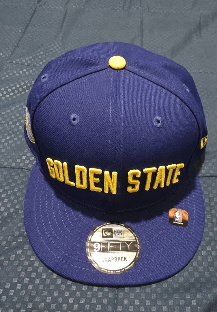 New Era Golden State Warriors Snapback Cap (Category: Caps & Hats) located in Santa Rosa. Submitted by rowhell09 (Listing ID 1462388040, Image 1). Description: GSW Cap Brandnew 1700 MOD. LBC MOP. BDO, GCASH LOC. NUEVA ECIJA - Brand: New Era - Model: 9FIFTY Snapback - Team: Golden State Warriors - Color: Blue with Yellow Embroidery - Features: Team logo on side, NBA logo at back - Closure: Adjustable Snapback - Condition: New.