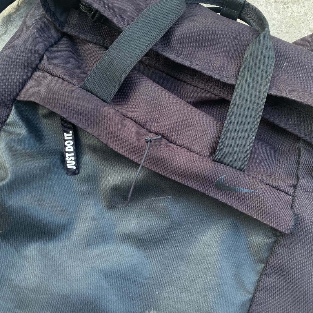 Nike Black Backpack "Just Do It" (Category: Backpacks) located in Zamboanga. Submitted by aisanglgma52490 (Listing ID 1462274546, Image 2). Description: - Black Nike backpack - Features the iconic "Just Do It" logo on the front pocket - Main compartment with a convenient roll-top closure - Made from durable polyester material.