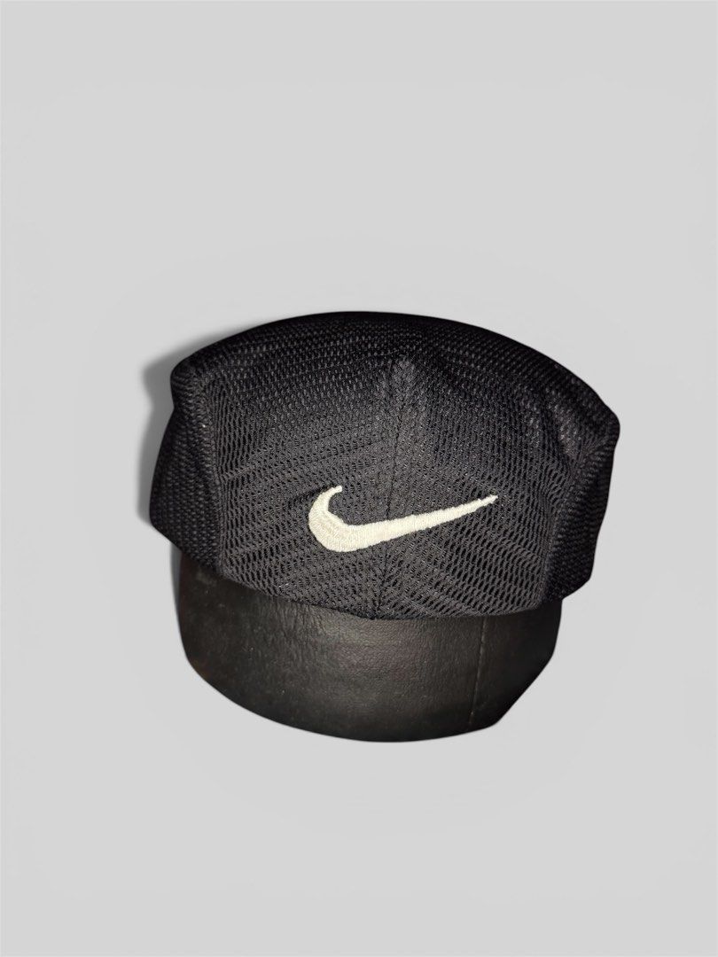 Nike Black Mesh Flat Cap Hat (Category: Caps & Hats) located in Roxas City. Submitted by patsquarephantz (Listing ID 1462326668, Image 1). Description: - Black Nike flat cap - Mesh material on top - Embroidered Nike swoosh logo on front - 'NIKE' text detail on the side - Ideal for casual wear or sports activities.