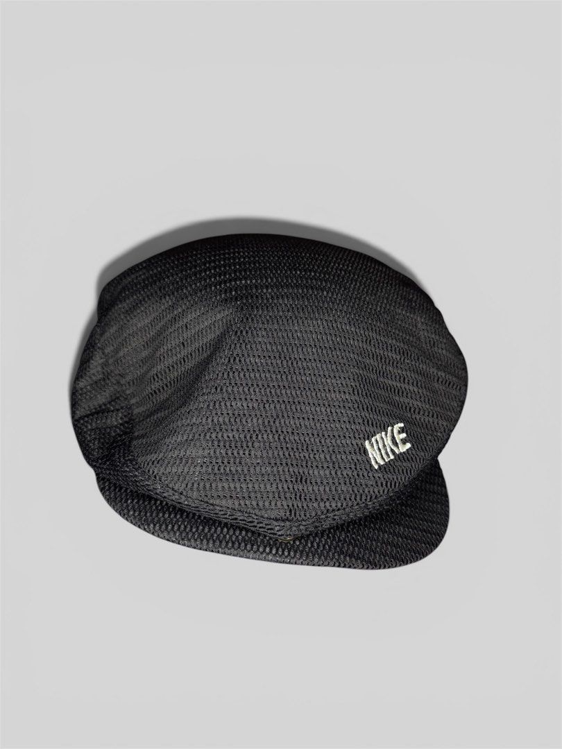 Nike Black Mesh Flat Cap Hat (Category: Caps & Hats) located in Roxas City. Submitted by patsquarephantz (Listing ID 1462326668, Image 3). Description: - Black Nike flat cap - Mesh material on top - Embroidered Nike swoosh logo on front - 'NIKE' text detail on the side - Ideal for casual wear or sports activities.