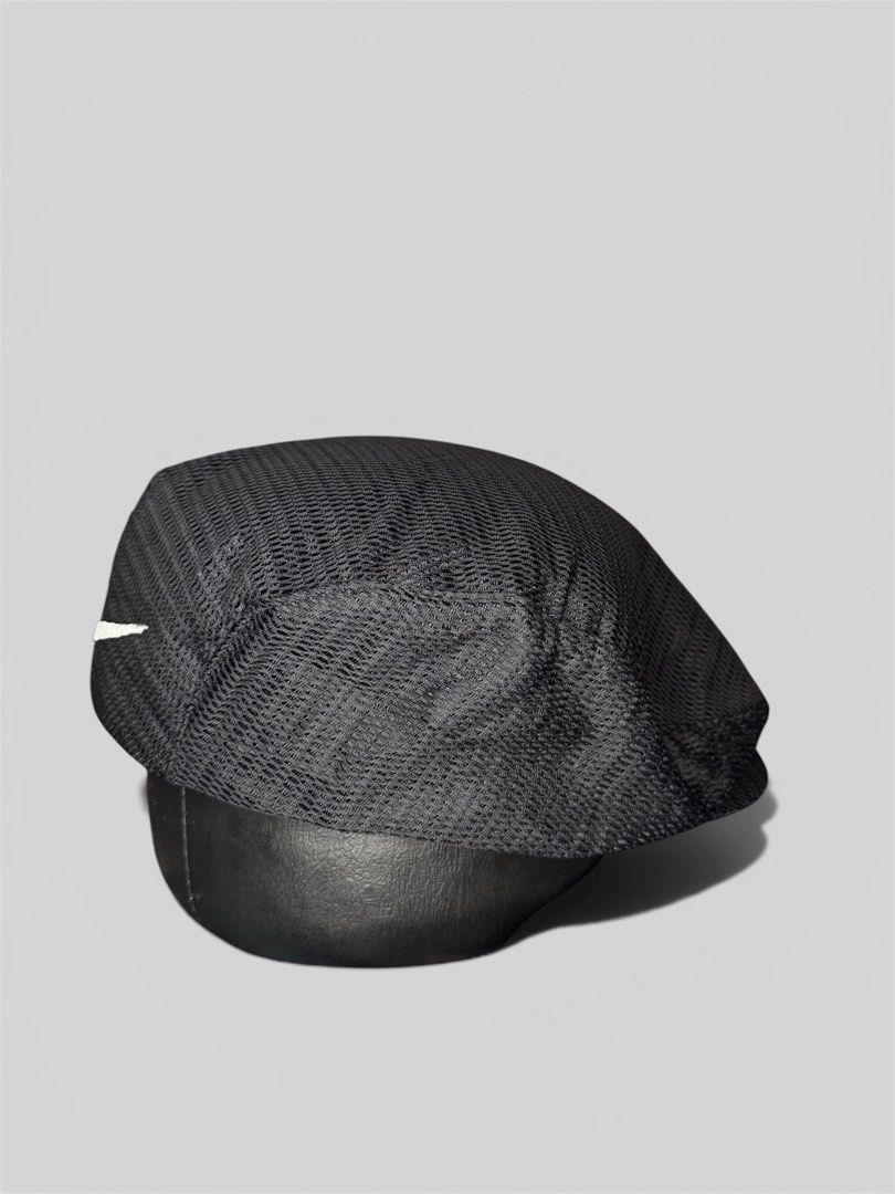 Nike Black Mesh Flat Cap Hat (Category: Caps & Hats) located in Roxas City. Submitted by patsquarephantz (Listing ID 1462326668, Image 2). Description: - Black Nike flat cap - Mesh material on top - Embroidered Nike swoosh logo on front - 'NIKE' text detail on the side - Ideal for casual wear or sports activities.