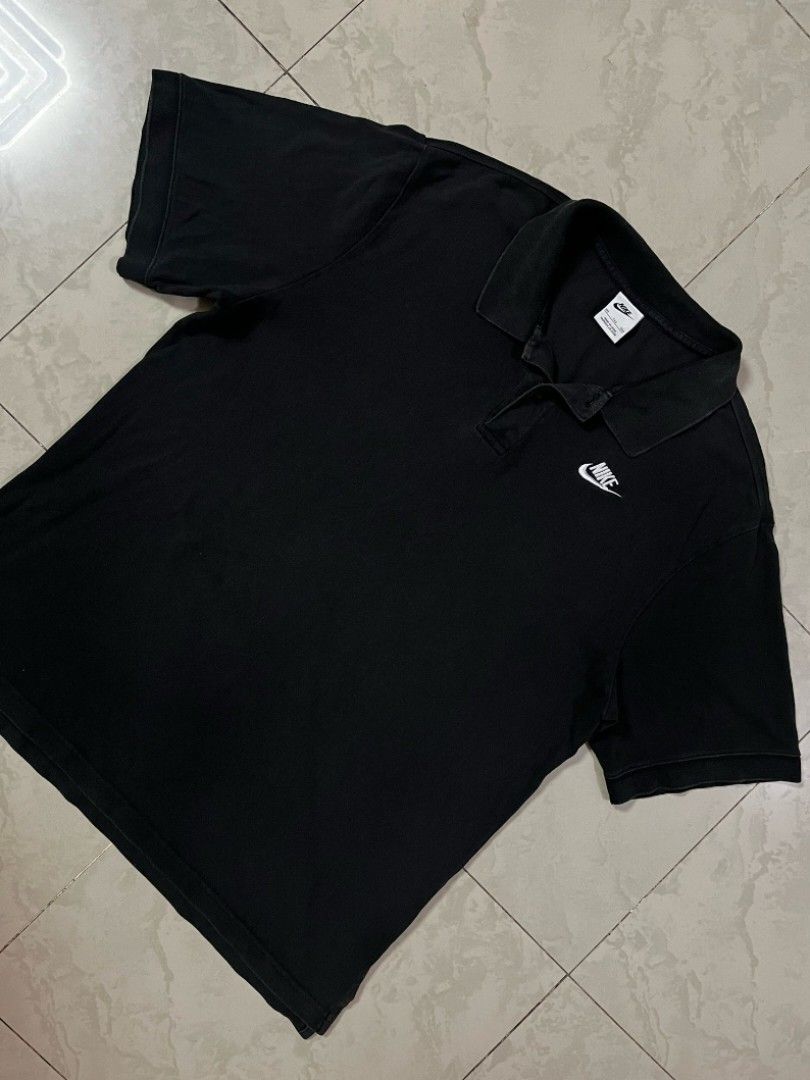 Nike Black Polo Shirt (Category: Tshirts & Polo Shirts ) located in Manila. Submitted by bognalosjo69319 (Listing ID 1462335873, Image 3). Description: - Classic black Nike polo shirt - Short sleeves with collar and button placket - Iconic embroidered Nike swoosh logo on chest - Versatile for everyday casual or sporty wear.