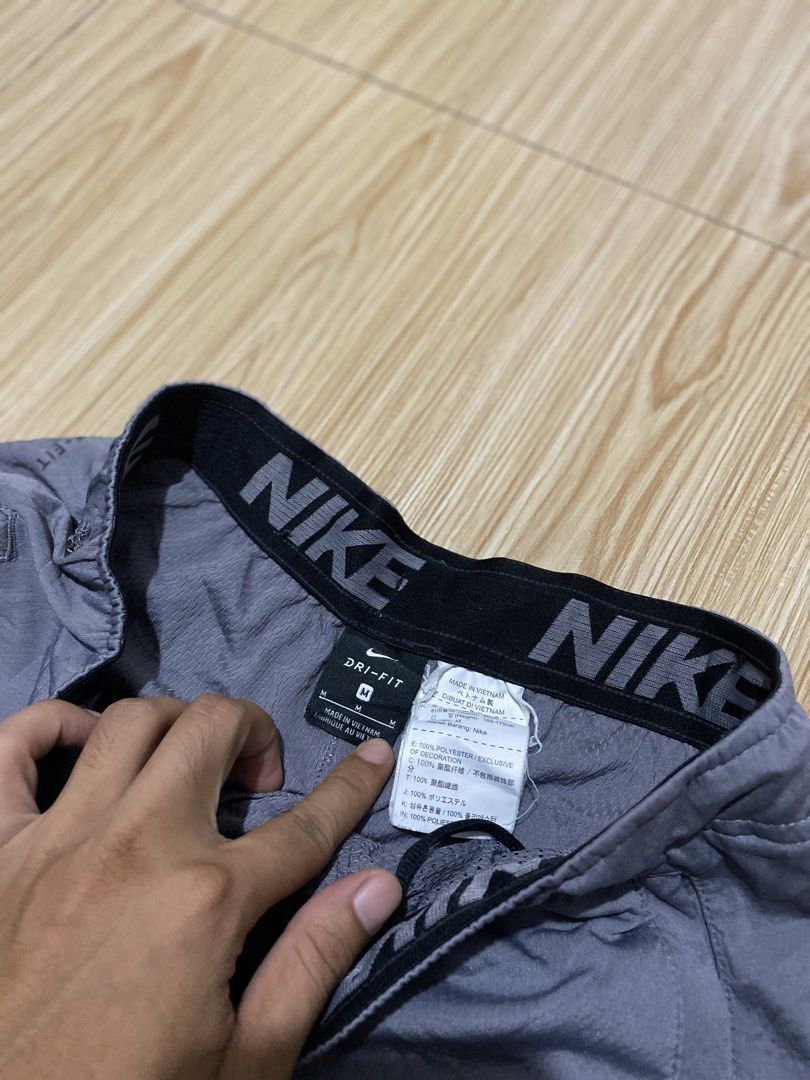 Nike Dri-Fit Grey Shorts Size M (Category: Shorts) located in Davao. Submitted by jayelcarba61168 (Listing ID 1462277276, Image 3). Description: - Grey Nike Dri-Fit shorts - Large black Nike graphic on the side - Elastic waistband with drawstring - Made in Vietnam - 100% polyester - Ideal for workouts or casual wear.