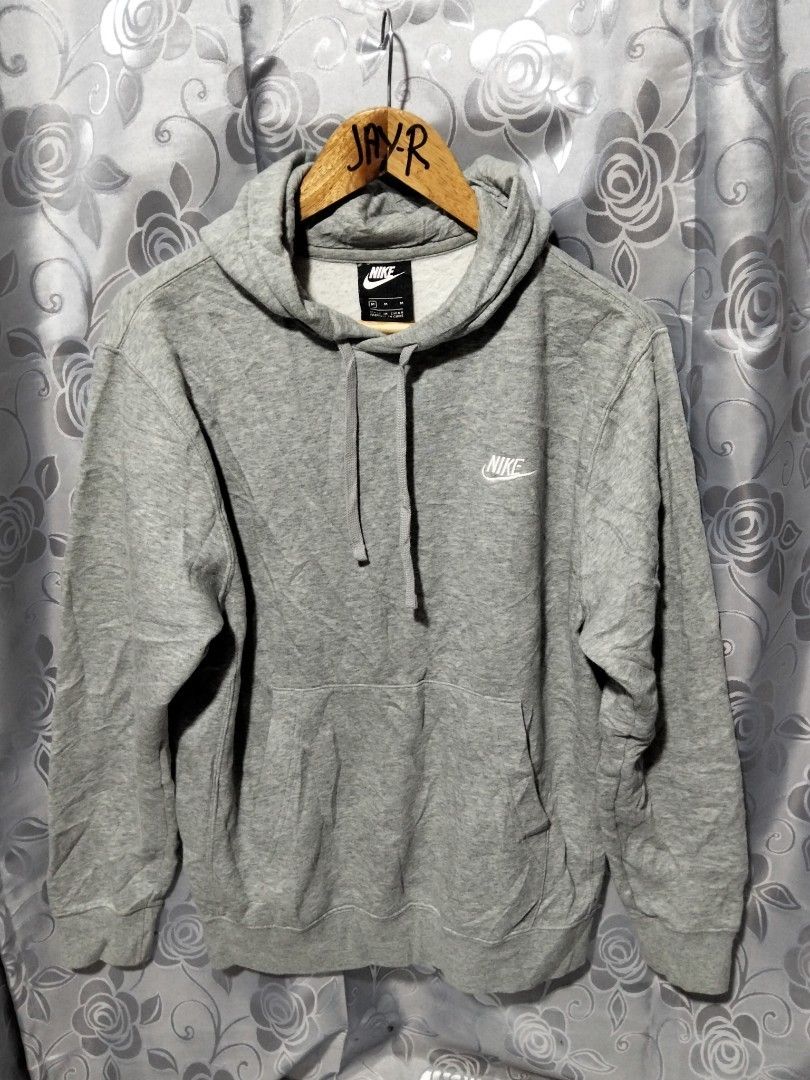 Nike Grey Hoodie Sweatshirt Pullover Size M (Category: Coats, Jackets and Outerwear) located in Manila. Submitted by brarynpag30556 (Listing ID 1462288485, Image 1). Description: - Classic grey Nike hoodie - Small embroidered Nike logo on chest - Comfortable cotton and polyester blend - Adjustable hood with drawstring - Convenient kangaroo pocket - Ideal for casual wear.