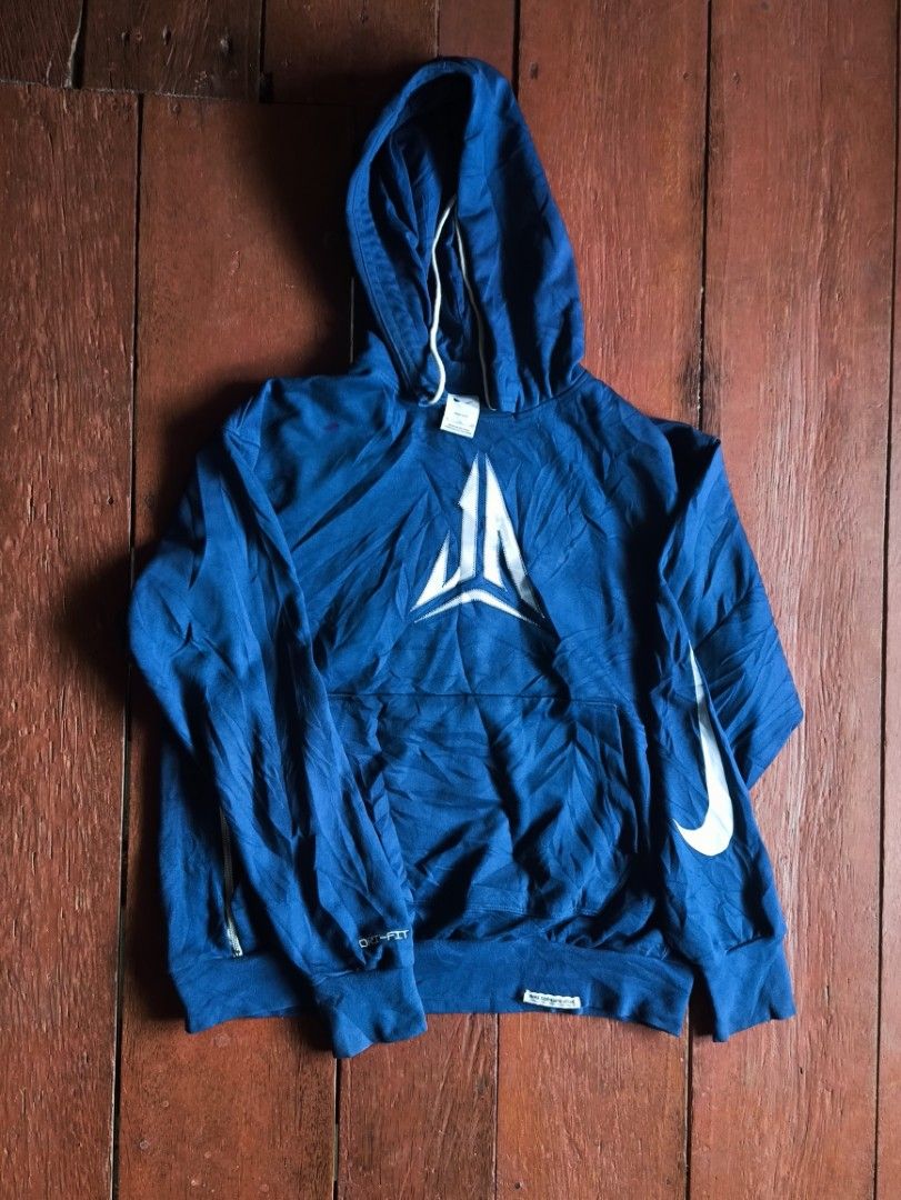 Nike JA Morant Hoodie (Category: Coats, Jackets and Outerwear) located in Dapitan. Submitted by roxfranz714 (Listing ID 1462436311, Image 1). Description: - Blue Nike hoodie - Large white graphic on front - 'Mamba' text with lightning graphics on back - Dri-FIT material for performance - Side zipper pockets for secure storage - Ideal for workouts or casual wear.