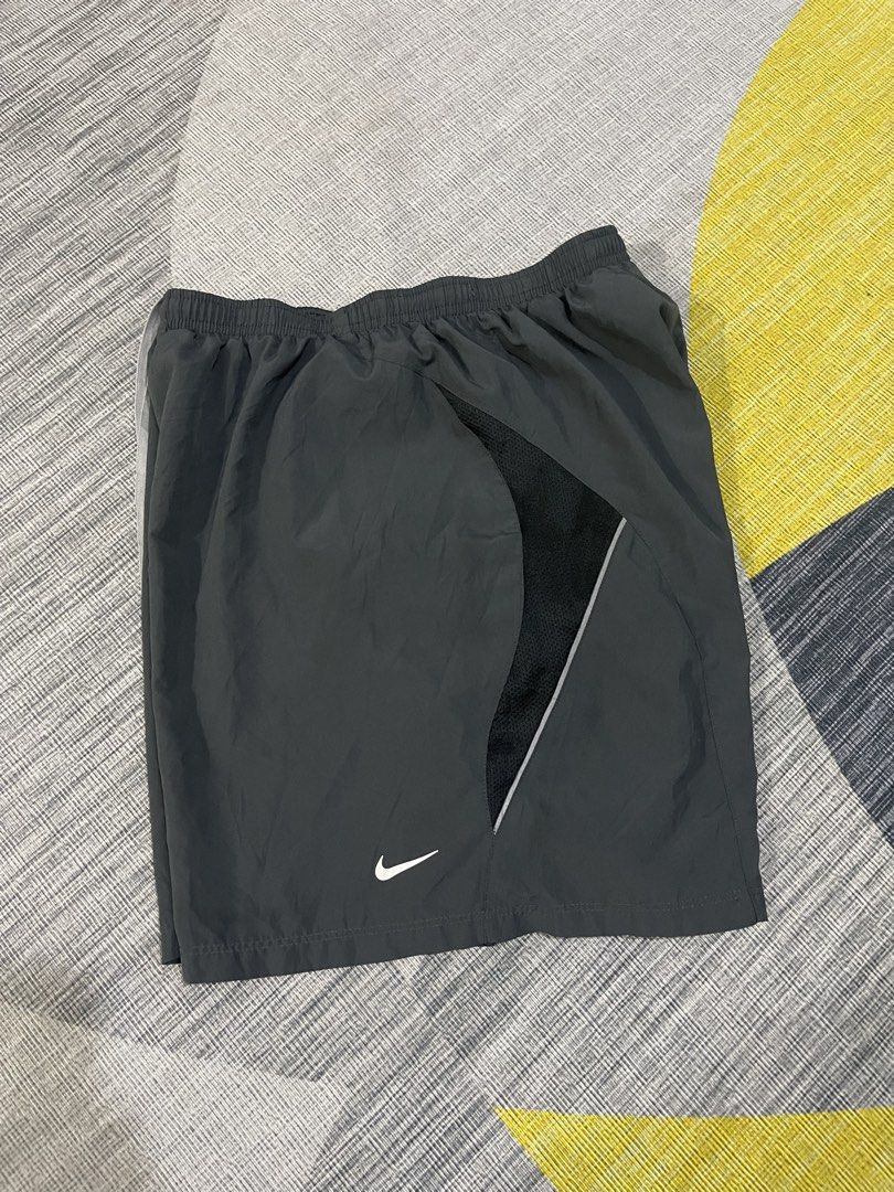 Nike mens running short (Category: Shorts) located in Taytay. Submitted by ekselentekondisyon (Listing ID 1462383107, Image 2). Description: Nike mens drifit runnings short Size medium W-26-34 L-15.5 Leg opening-13 Above the knee Taytay rizal location Good condition W/lace W/inner.