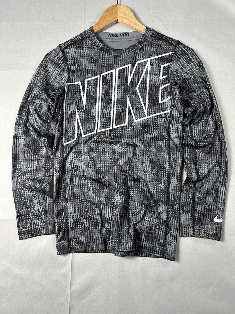 Nike Pro Compression Shirt (Category: Activewear) located in Cabanglasan. Submitted by thefashiongarage.co (Listing ID 1462439406, Image 1). Description: Title - Nike Pro Model/Name - Compression Shirt Size on Tag - XL Can fit to XXS women Conditiion - Excellent as new Dimension (WxLxH) - 15x24 Inches Category- Work out Shirt Fitting - Fitted Made in - Sri Lanka Material - 88% Polyester/ 12% Spandex Color - Gray/Black Design - Camou Year - Inclus