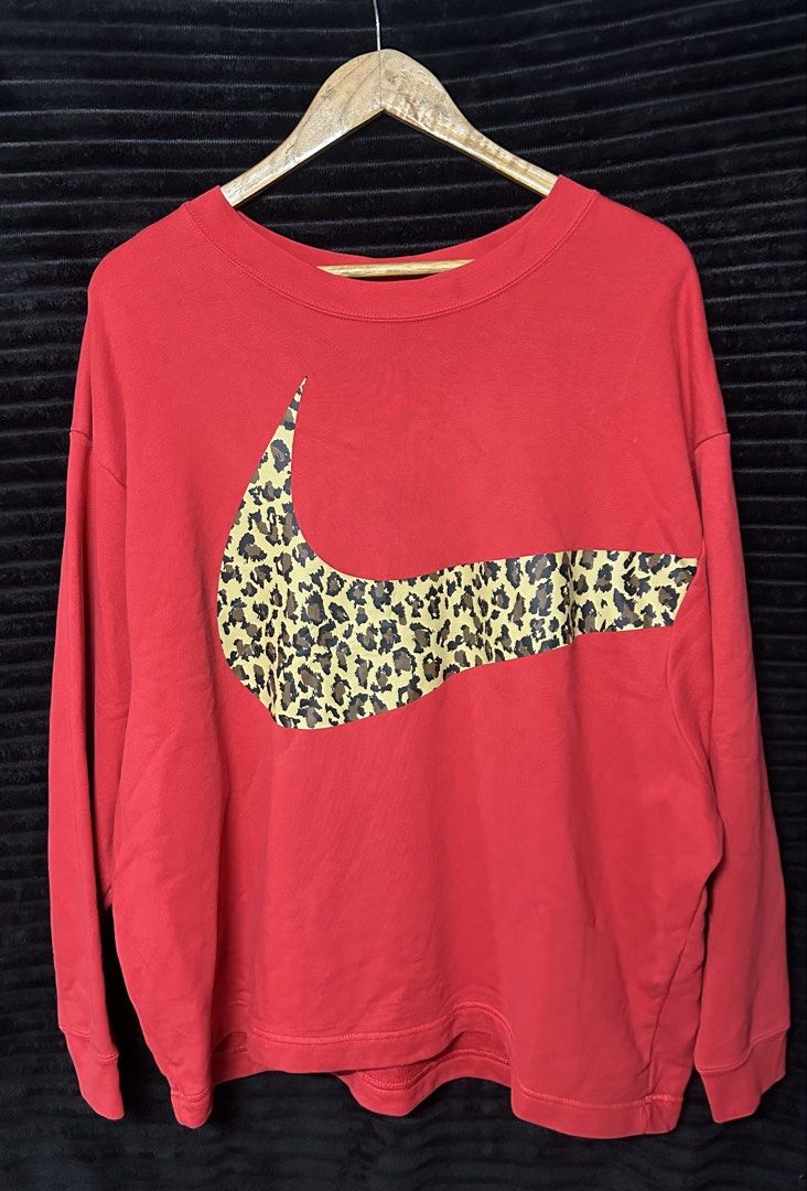 Nike Red Leopard Swoosh Crewneck Sweatshirt (Category: Coats, Jackets and Outerwear) located in Taguig. Submitted by thriftboy23 (Listing ID 1462333411, Image 1). Description: Excellent Condition Color rate: 10/10 Flawless Size XL Width: 25.5 Length: 27.