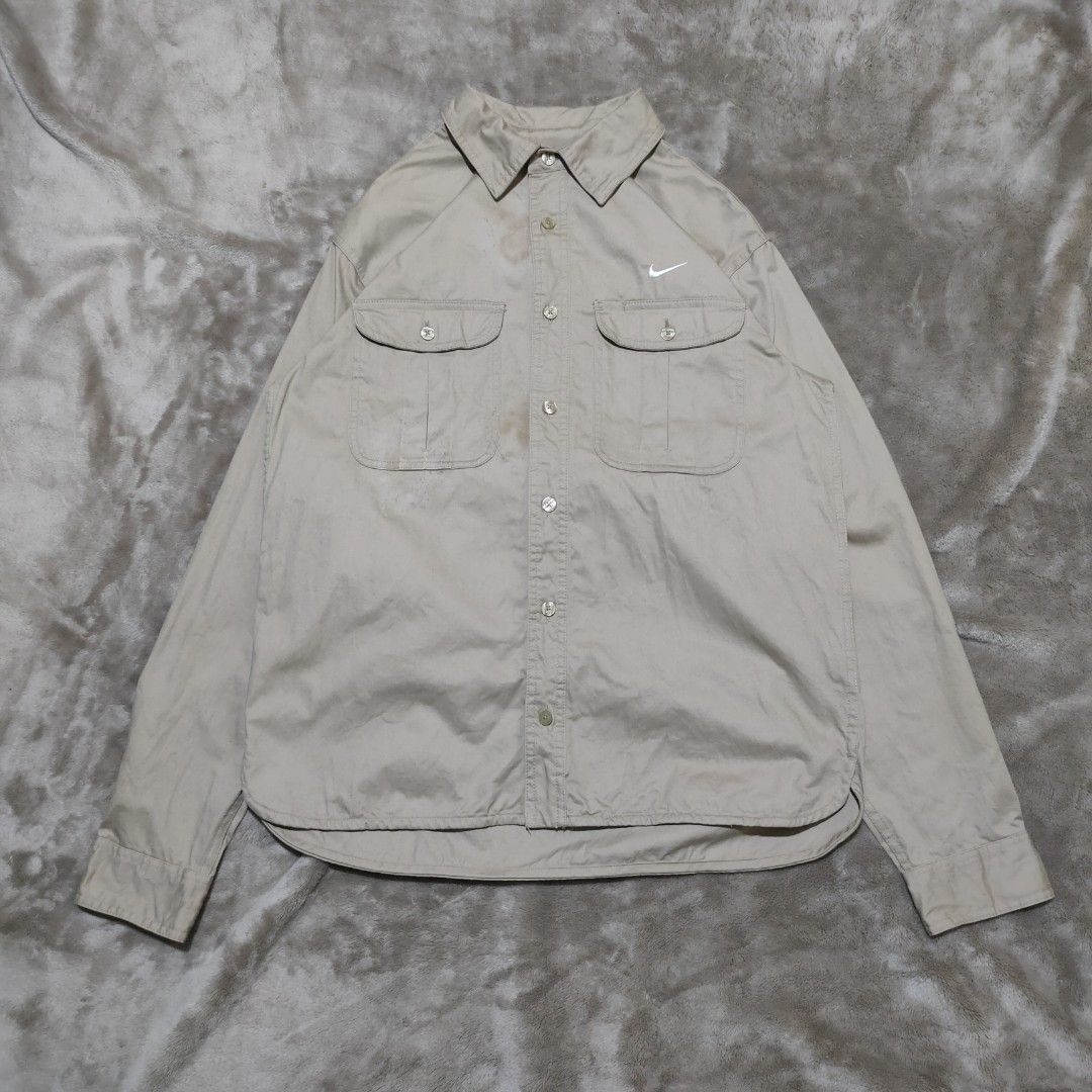 Nike SB Khaki Button Up Shirt (Category: Tshirts & Polo Shirts ) located in Taguig. Submitted by actualizeboutique (Listing ID 1462350984, Image 1). Description: - Khaki Nike SB button-up shirt - Tagged size M - Two chest pockets - Small embroidered Nike swoosh - Made in China - Note: Faint marks on collar area, please check photos for details..