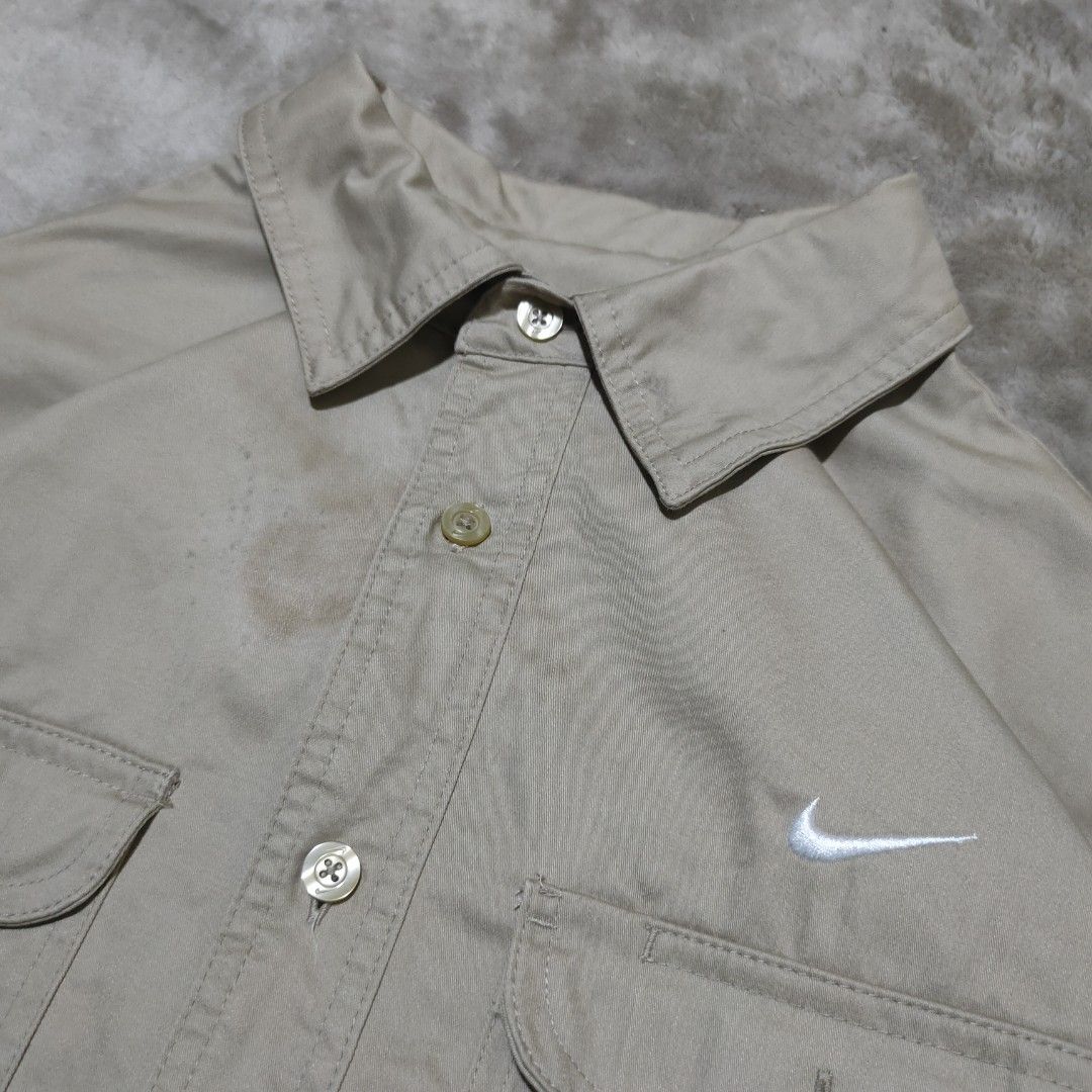 Nike SB Khaki Button Up Shirt (Category: Tshirts & Polo Shirts ) located in Taguig. Submitted by actualizeboutique (Listing ID 1462350984, Image 2). Description: - Khaki Nike SB button-up shirt - Tagged size M - Two chest pockets - Small embroidered Nike swoosh - Made in China - Note: Faint marks on collar area, please check photos for details..