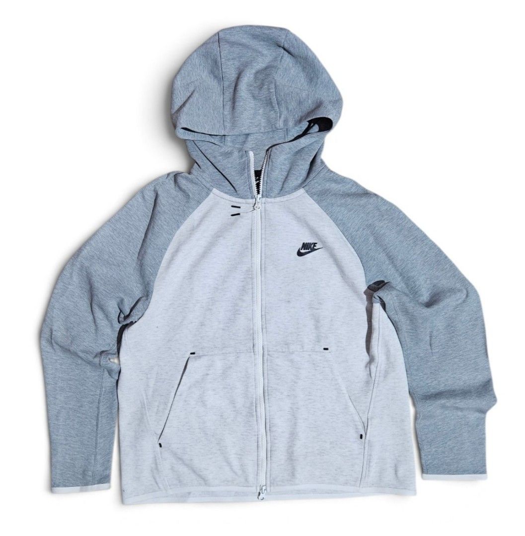 Nike Tech Fleece Full Zip Hoodie Grey (Category: Coats, Jackets and Outerwear) located in Las Pinas. Submitted by rcp123 (Listing ID 1462361896, Image 1). Description: - Nike Tech Fleece Hoodie - Color: Grey and Light Grey - Size: L - Features: Full zip closure, pockets, raglan sleeves - Condition: Minor snag on sleeve seam - Made in China.