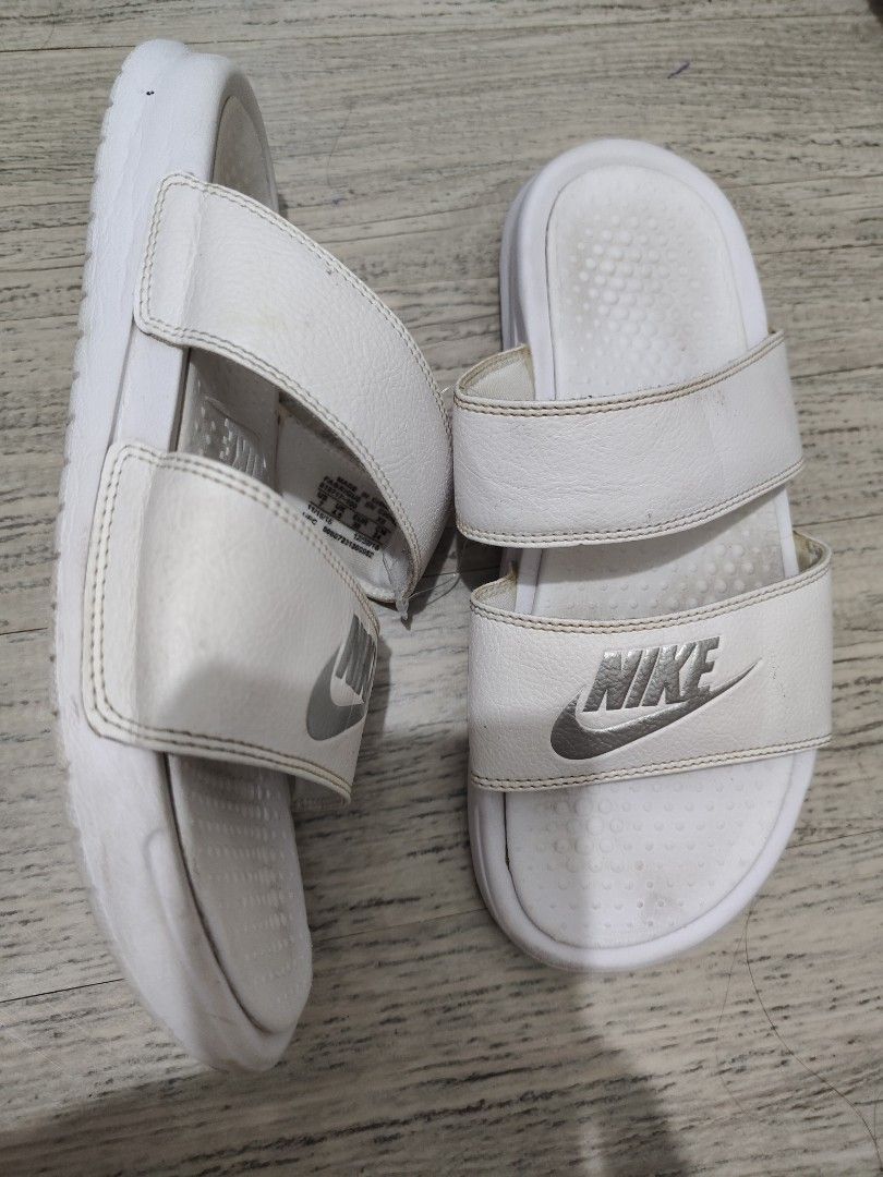 Nike White Dual Strap Slide Sandals - US7 (Category: Flats & Sandals) located in Calamba. Submitted by an_ne0501 (Listing ID 1462297530, Image 2). Description: - White Nike slide sandals - Dual strap design for a secure and comfortable fit - Perfect for casual outings or lounging - Size: US 7 / UK 4.5 / EUR 38 / CM 24 - Please note: Minor signs of wear on footbed and straps.
