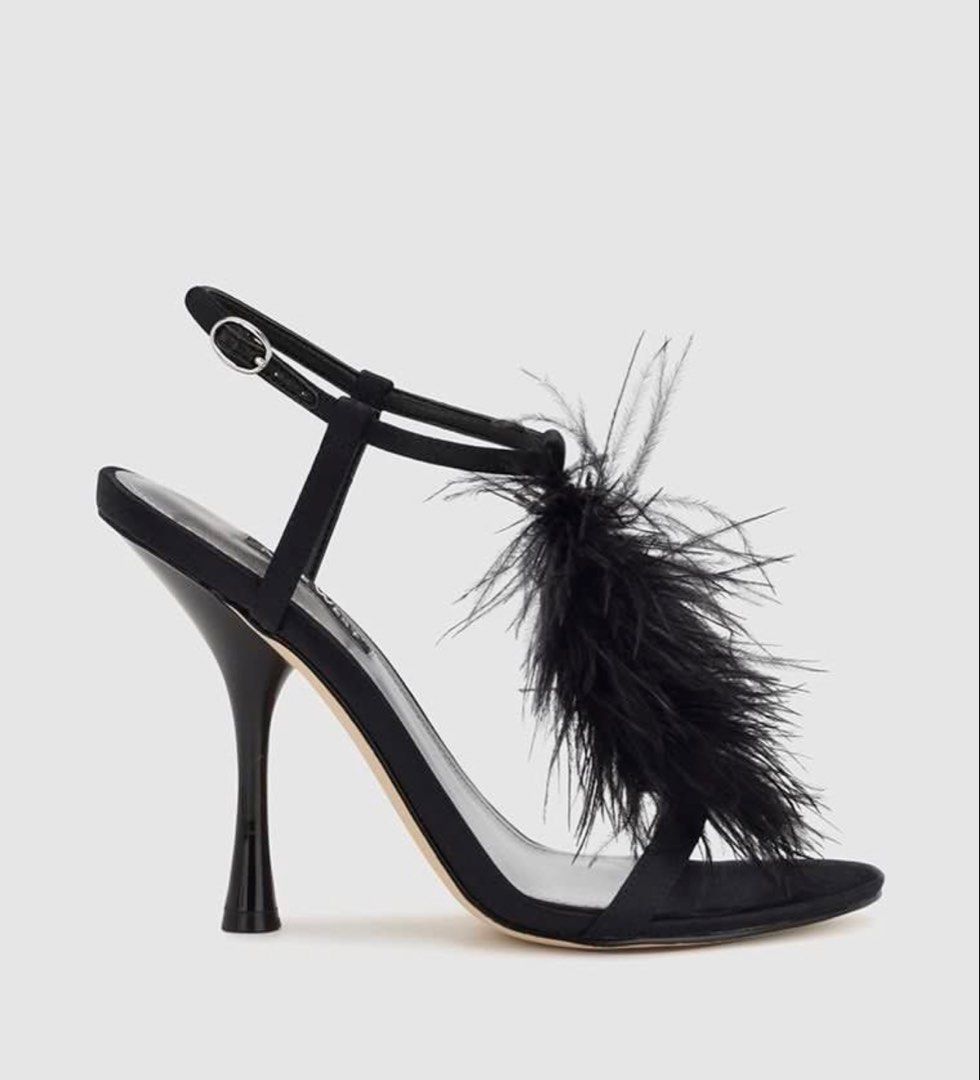 Nine West Black Feather Stiletto Heels (Category: Heels) located in Manila. Submitted by absdeclutter (Listing ID 1462284775, Image 2). Description: - Brand: Nine West - Color: Black - Design: Strappy with feather detailing - Closure: Ankle buckle - Heel Type: High stiletto - Occasion: Perfect for night outs or special occasions - Style: Adds glam to any outfit Worn once!! Like new Orig price: 6,450.00.