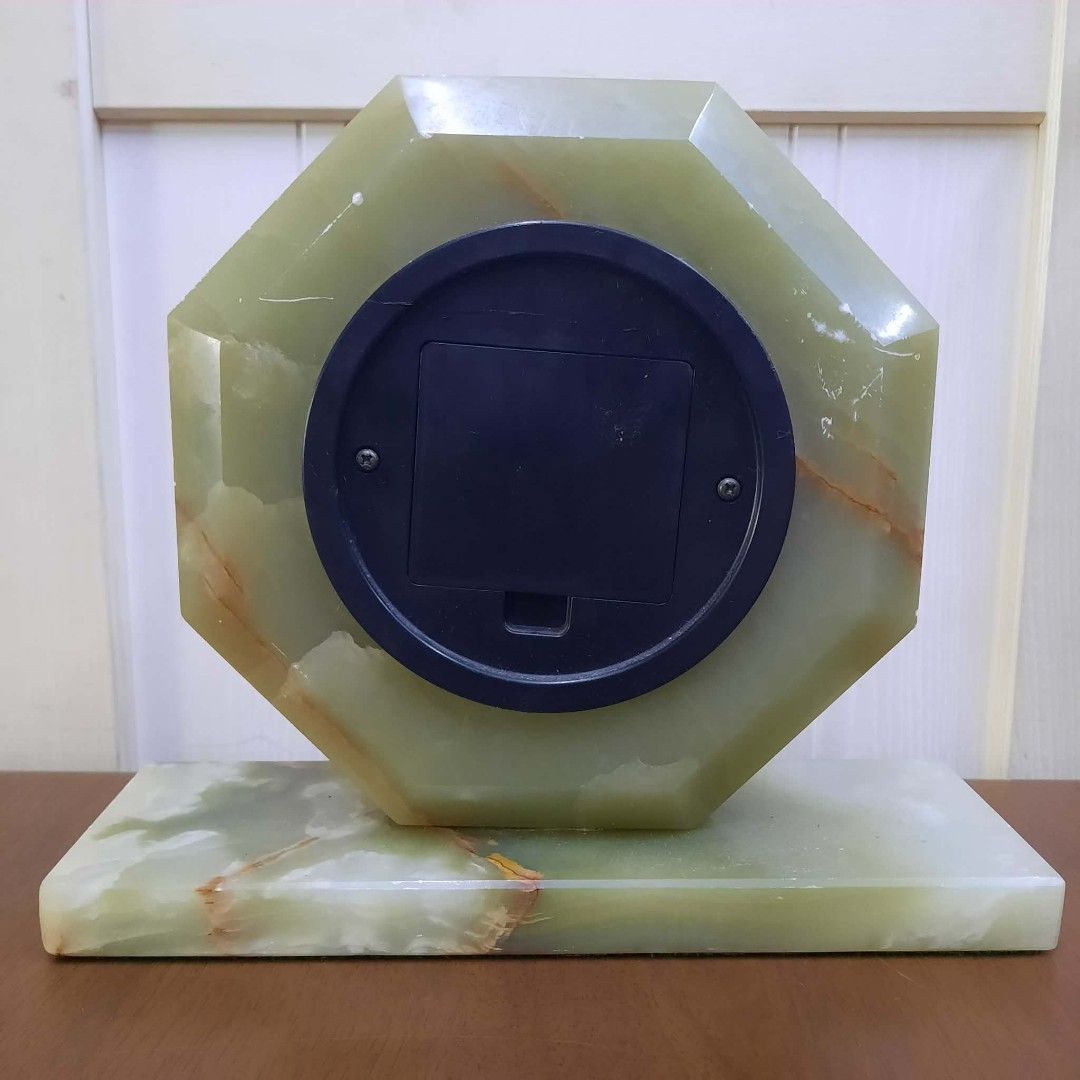 Octagonal Onyx Quartz Desk Clock (Category: Clocks) located in Manila. Submitted by ivan_furnitures421 (Listing ID 1462278042, Image 3). Description: - Octagonal desk clock crafted from luxurious green onyx. - Features a classic black face with Roman numerals. - Elegant gold-tone hands. - Set on a sturdy, matching onyx base. - Reliable quartz movement for accurate timekeeping. - A sophisticated decorative piece for desks, shelves, or mantels..