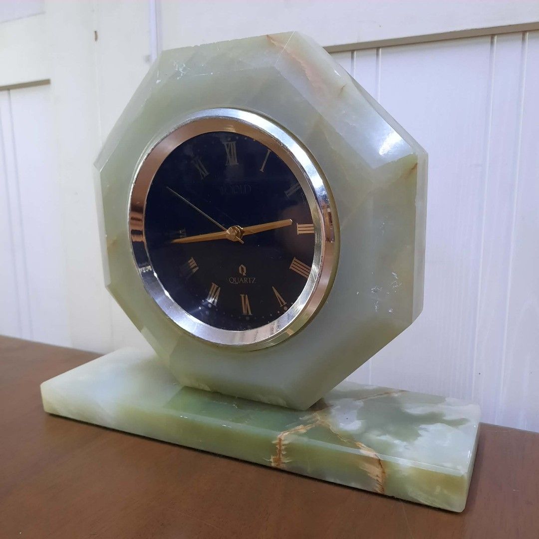 Octagonal Onyx Quartz Desk Clock (Category: Clocks) located in Manila. Submitted by ivan_furnitures421 (Listing ID 1462278042, Image 1). Description: - Octagonal desk clock crafted from luxurious green onyx. - Features a classic black face with Roman numerals. - Elegant gold-tone hands. - Set on a sturdy, matching onyx base. - Reliable quartz movement for accurate timekeeping. - A sophisticated decorative piece for desks, shelves, or mantels..
