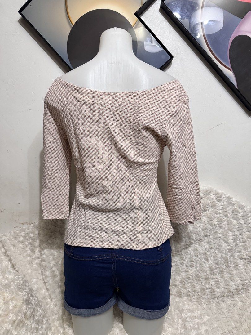 Off-shoulder Gingham Long Sleeve Top (Category: Longsleeves) located in Marikina City. Submitted by lorradel (Listing ID 1462264482, Image 3). Description: - fits M-L - Cute off-shoulder top - Pink and white gingham pattern - Three-quarter sleeves - Lightweight fabric, perfect for warm weather - Versatile: pairs well with shorts or jeans - Simple and stylish design - MAY HAVE some washable stains (hindi maiiwasan) needs washing; had been stored -