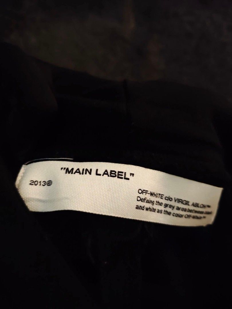 OFF-WHITE "Main Label" Surrealist (Category: Coats, Jackets and Outerwear) located in Quezon City. Submitted by rezno (Listing ID 1462435529, Image 3). Description: - Authentic OFF-WHITE Hoodie - Color: Black - Size: L - XL 23 x 29 - Back Graphic: Iconic cloud design - Front Graphic: Orange bird - Left Sleeve Detail: 'Surrealist' text - Right Sleeve Detail: Diagonal stripes - Origin: Made in Portugal.